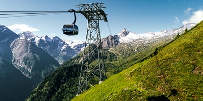 Mountainbike Urlaub - Ladestation Elektroauto - Wagrain - Gondelbahn zum Kitzsteinhorn Gletscher - Hotel Sonnblick