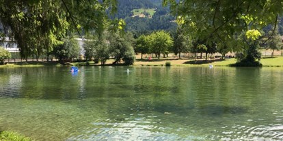 Mountainbike Urlaub - Garten - Natz - kostenloser Naturbadesee
(300 m vom Hotel entfernt) - Hotel Innerhofer 
