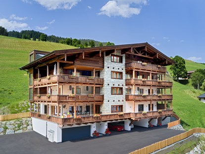 Mountainbike Urlaub - Servicestation - Kirchberg in Tirol - Außenansicht Sommer Mei.Berg Appartementhaus - Mei.Berg