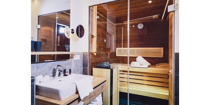 Mountainbike Urlaub - Fahrradraum: versperrbar - Leogang - Bathroom with Sauna - Stockinggut by AvenidA | Hotel & Residences