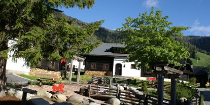 Mountainbike Urlaub - Sauna - Kärnten - Dorfplatz Dorf Kleinwild - Slow Travel Resort Kirchleitn