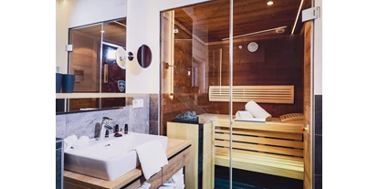 Mountainbike Urlaub - Sauna - Ginau - Bathroom with Sauna - Stockinggut by AvenidA | Hotel & Residences