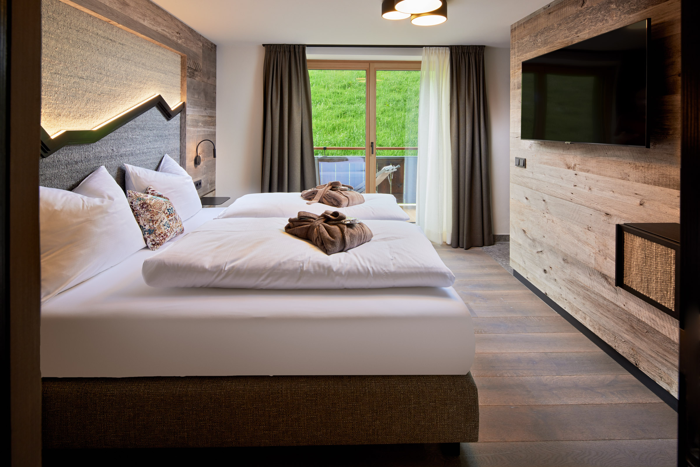 Mountainbikehotel: Mei.Auszeit Schlafzimmer mit Zugang zum Balkon - Mei.Berg