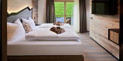 Mountainbike Urlaub - MTB-Region: AT - Saalbach - Mei.Auszeit Schlafzimmer mit Zugang zum Balkon - Mei.Berg