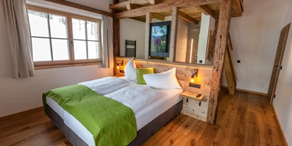 Mountainbike Urlaub - Ellmau - Zimmer mit offenen Badezimmer und Juchee im Chalet Sepp - Chalets Marolden