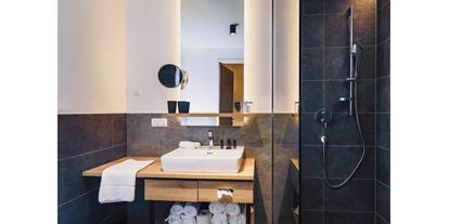Mountainbike Urlaub - Ellmau - Bathroom - Stockinggut by AvenidA | Hotel & Residences