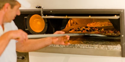Mountainbike Urlaub - Südtirol - Leckere Pizzas vom Holzofen - BikeHotel Terzer