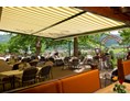 Mountainbikehotel: Nach der MTB-Tour - Kulinarik und ein StegerBRÄU im schönen Gastgarten mit Blick auf die Radstädter Tauern genießen - Hotel Stegerbräu Radstadt im Pongau